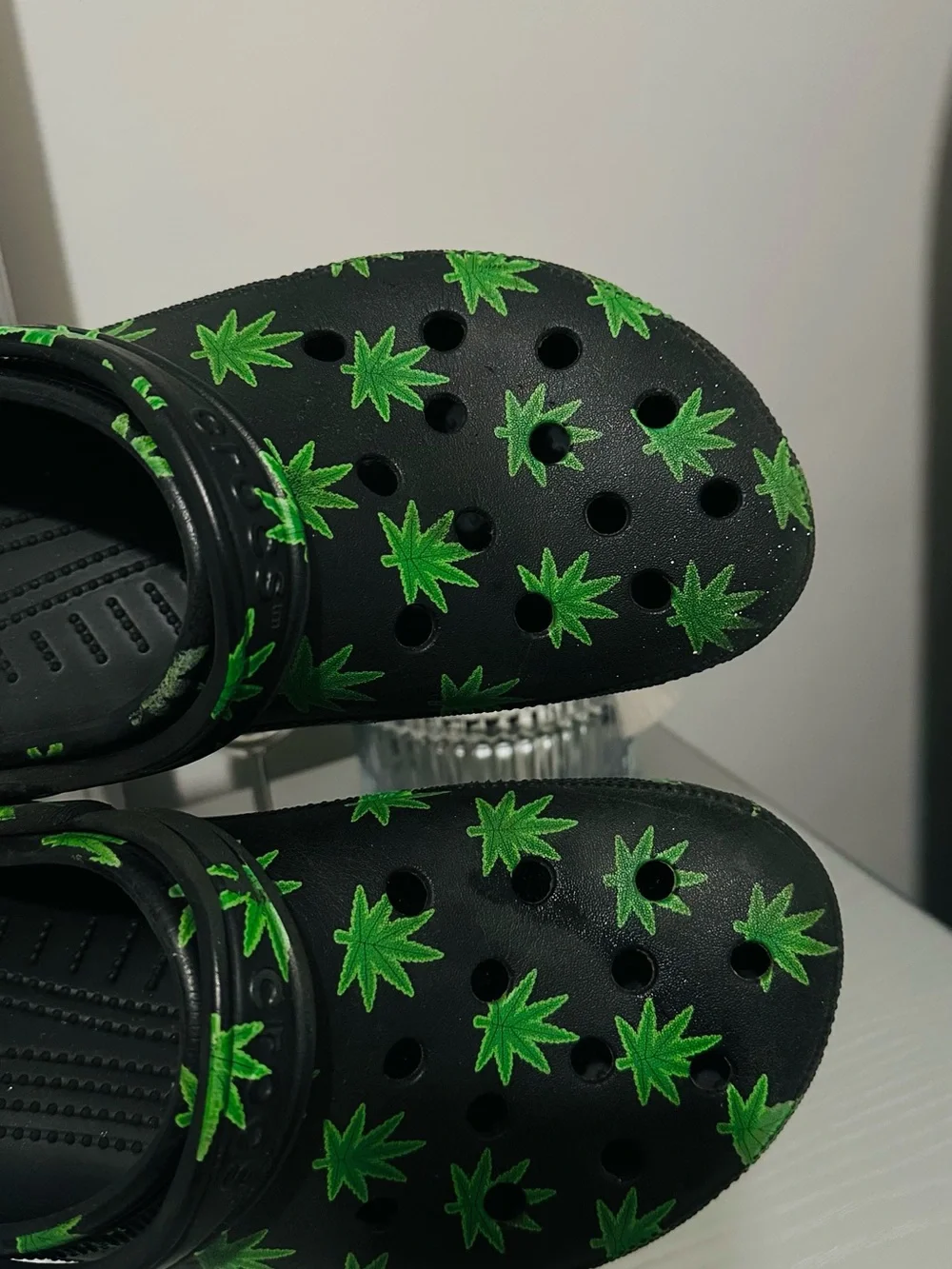 CROCS Black Slip-On Clogs with Green Leaf Print